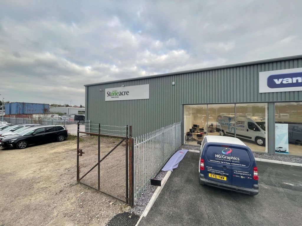 Exterior signage installation for a Stoneacre showroom.