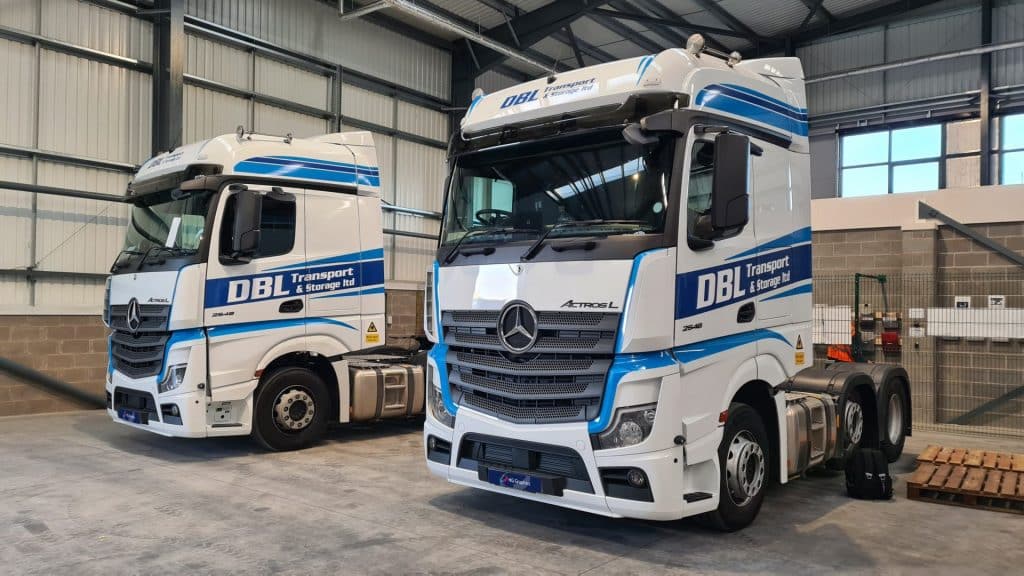 A fleet of trucks wrapped for DBL.