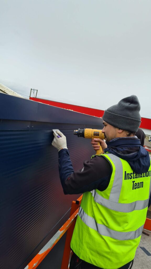 Installation of exterior cladding by HG Surface.