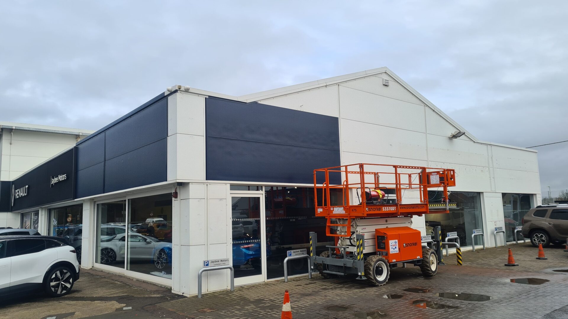 Exterior cladding for a car showroom.